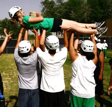 Several cadets holding up another
