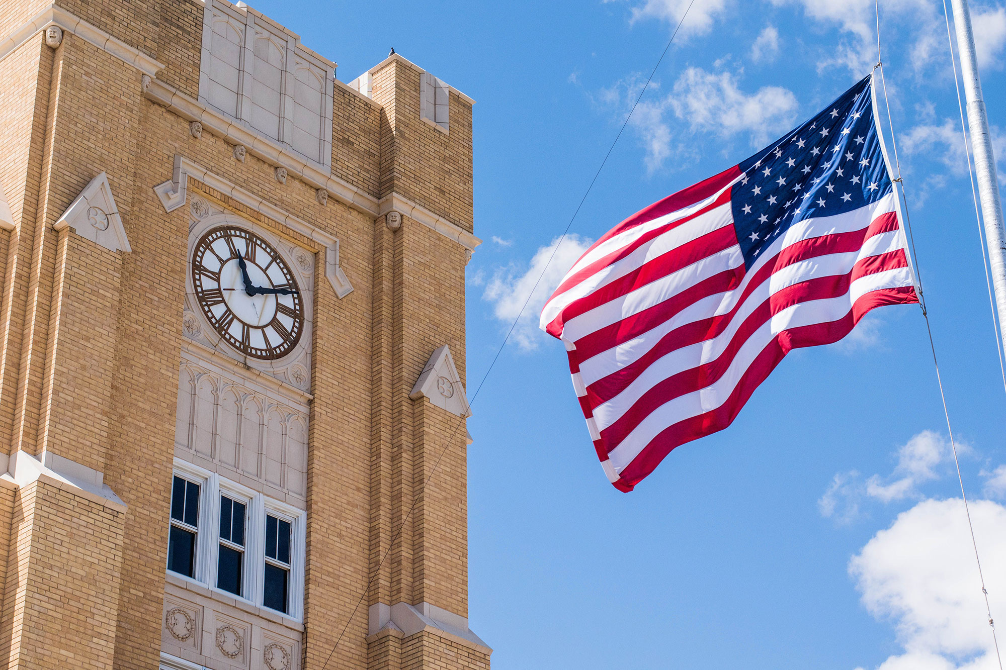 American flag flying in front of Lusk Hall