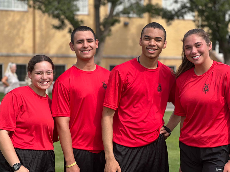 Happy cadets wearing red shirts